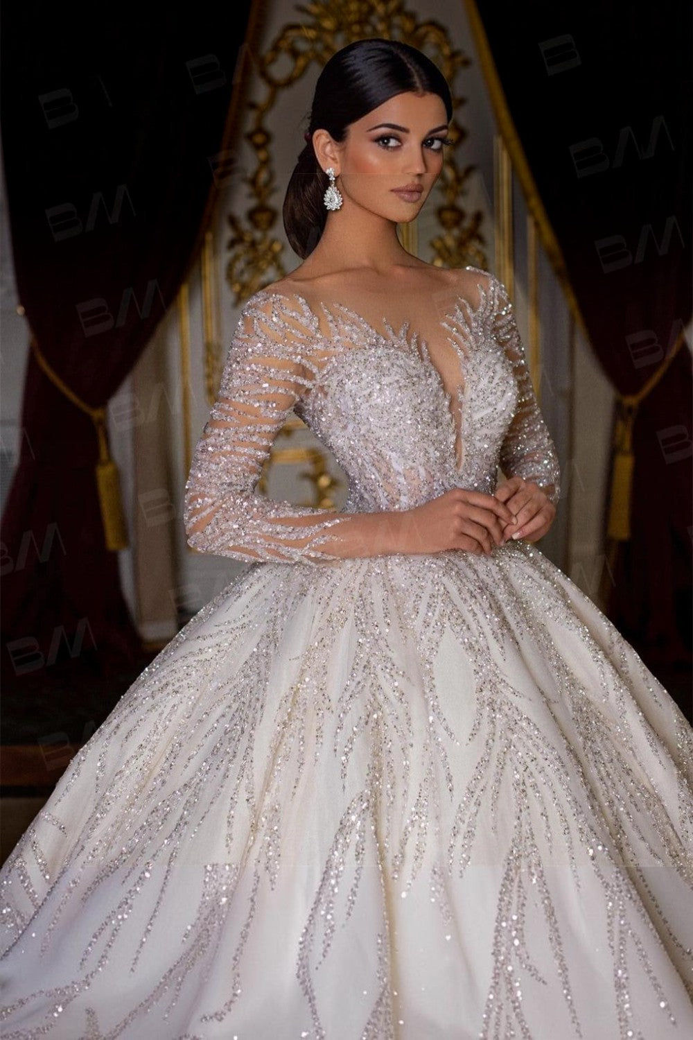 TheBlissWedding long sleeve ball gown wedding dress with intricate hand-beaded sequin embellishments and scoop neckline.