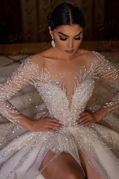 TheBlissWedding long sleeve ball gown wedding dress with intricate hand-beaded sequin embellishments and scoop neckline