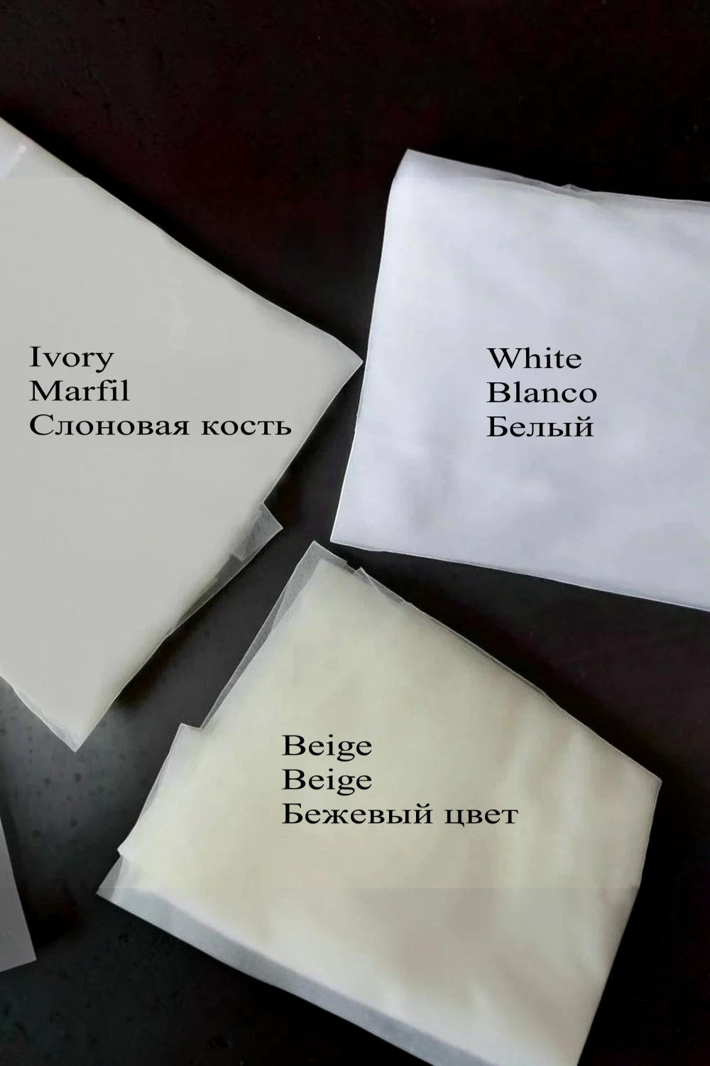 TheBlissWedding fabric color swatches for wedding dresses including ivory, white, and beige tulle and chiffon samples.