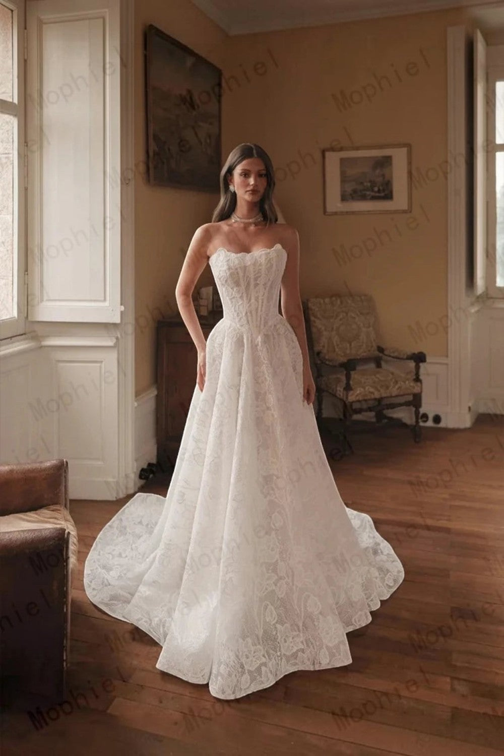 TheBlissWedding strapless A-line wedding dress in ivory lace with a floor-length skirt and sweep train in a vintage room.