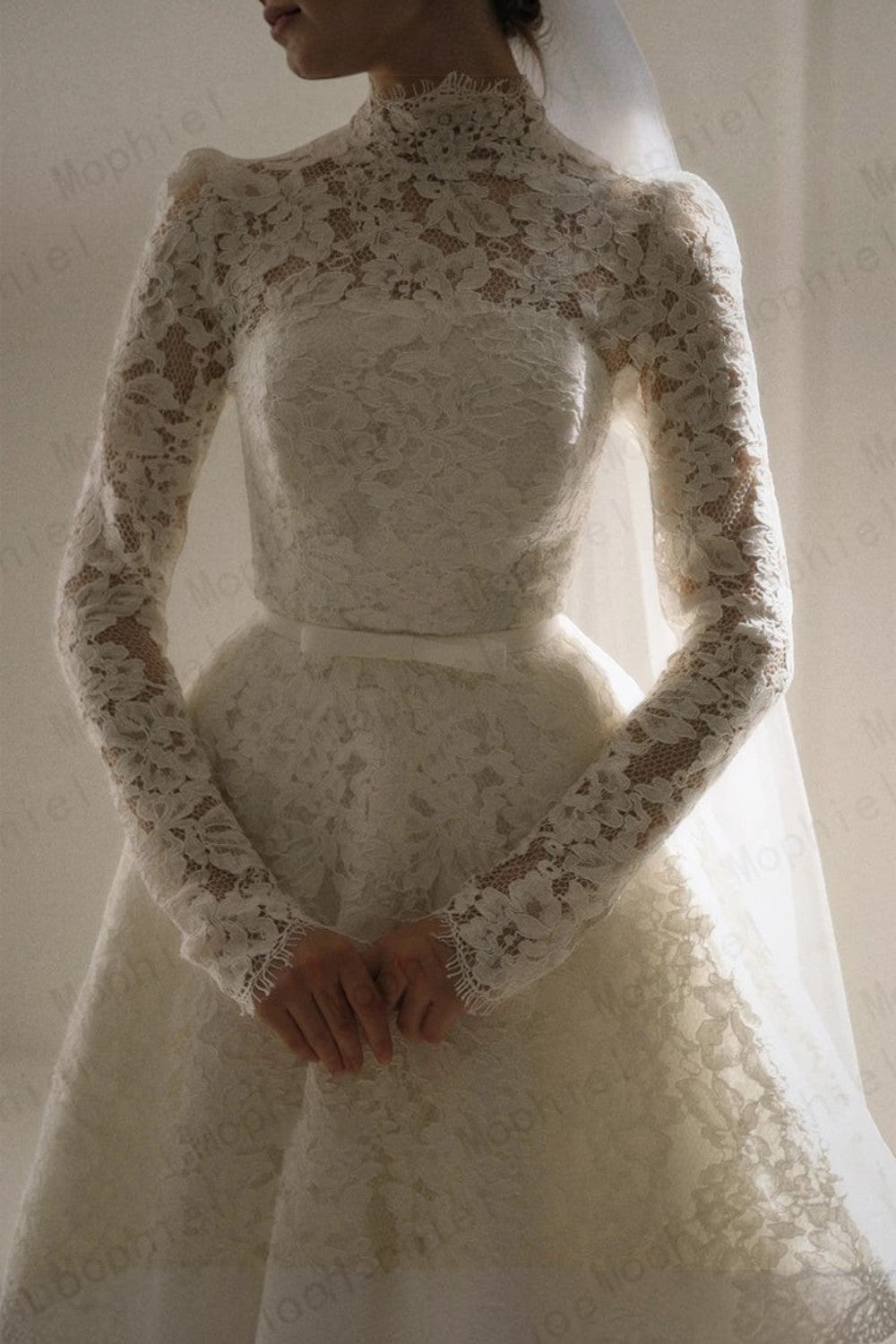 TheBlissWedding modest Muslim wedding dress with high neck, long lace sleeves, and a classic A-line silhouette.