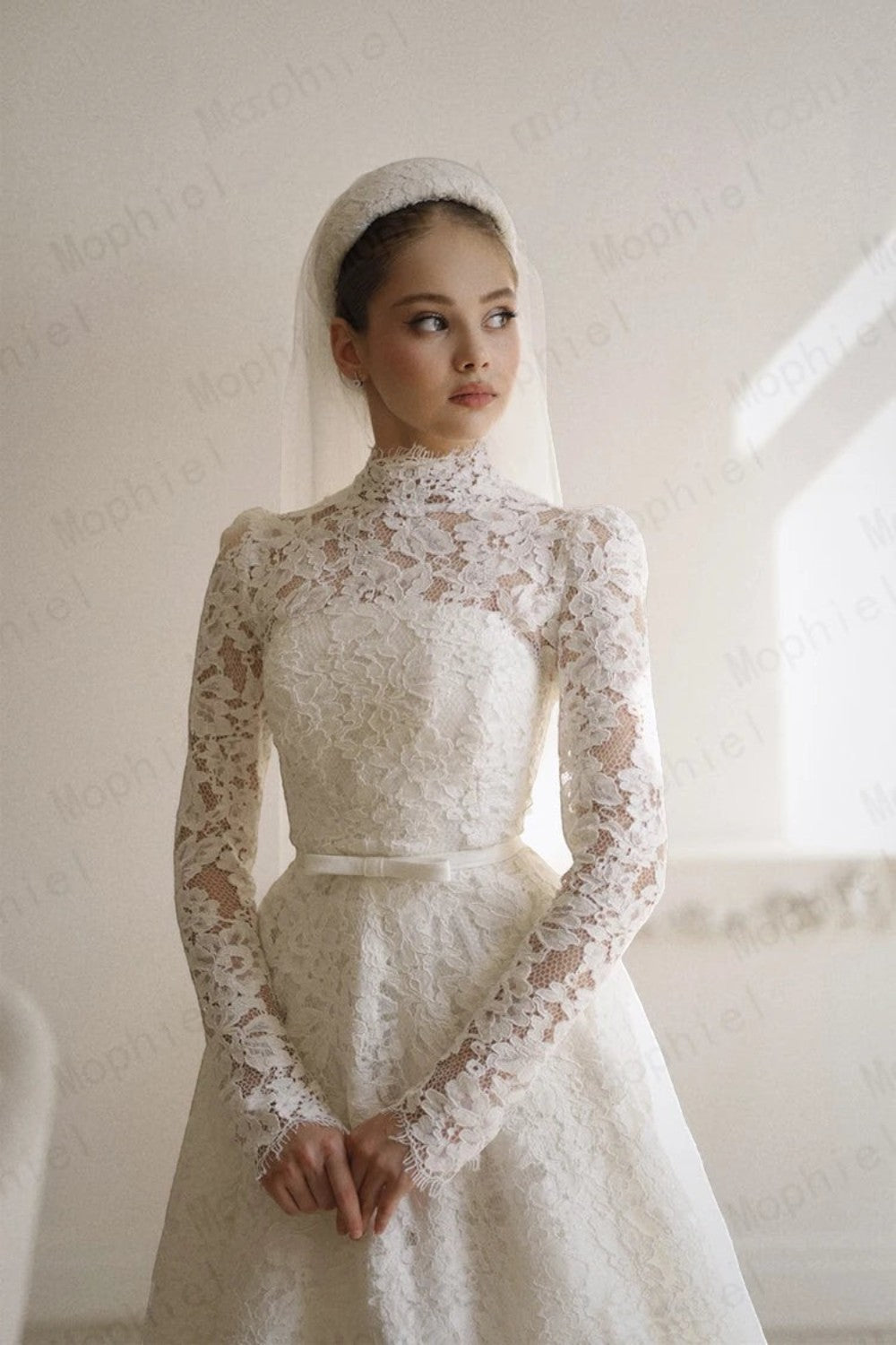 TheBlissWedding modest A-line bridal gown with high neck, long lace sleeves, and matching veil in ivory.