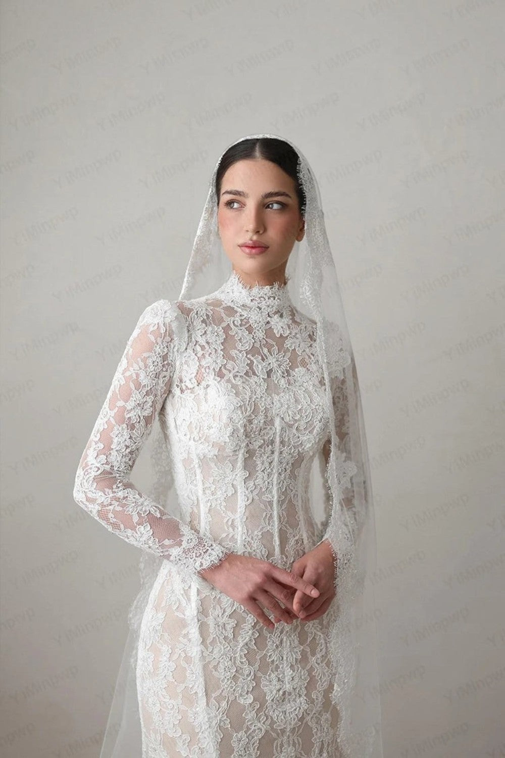 TheBlissWedding white lace mermaid wedding dress with high neck, long sleeves, and a matching bridal veil.