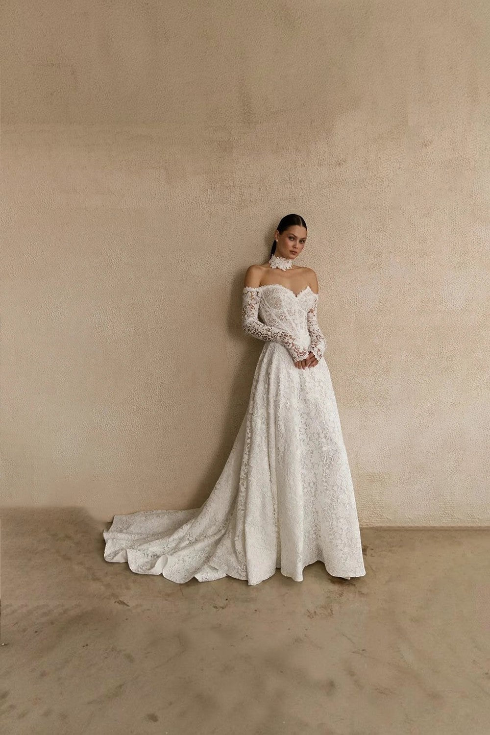 TheBlissWedding white lace A-line wedding dress with off-shoulder sweetheart neckline, long sleeves, and sweep train.