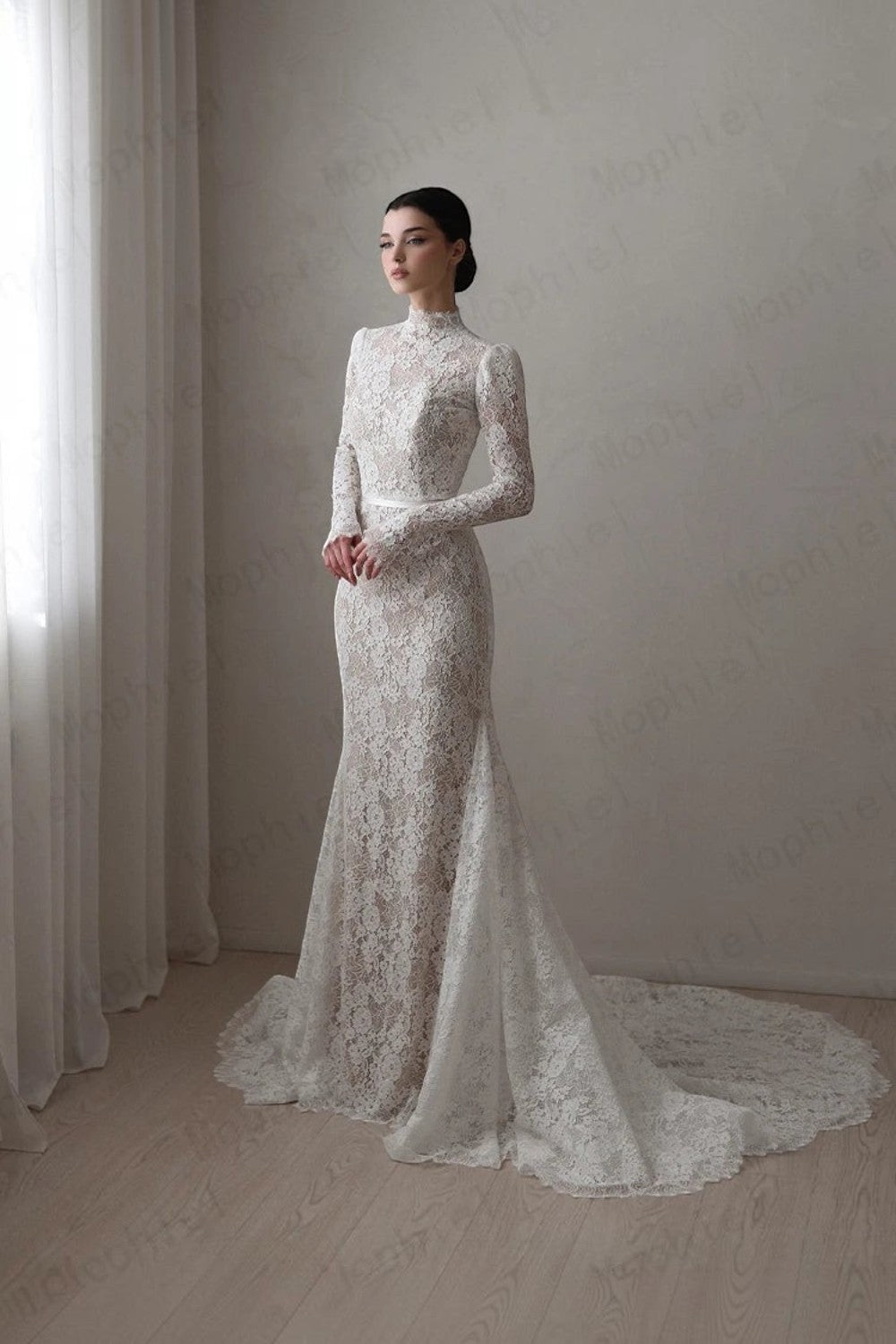 TheBlissWedding mermaid bridal gown with high neck, long lace sleeves, and a sweep train in white floral lace.