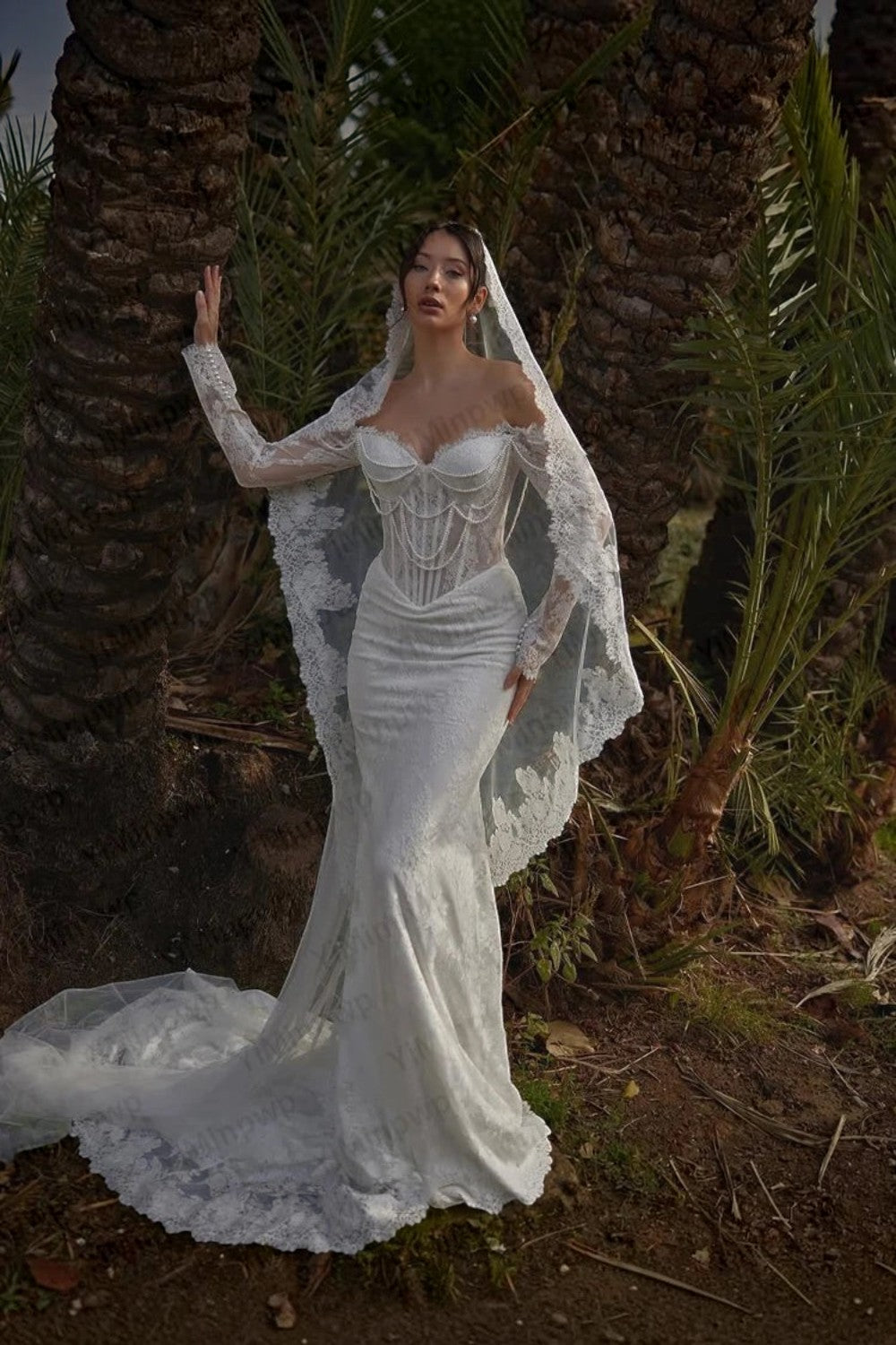 TheBlissWedding mermaid bridal gown with off-shoulder long sleeves, lace, pearl embellishments, and a sweep train.