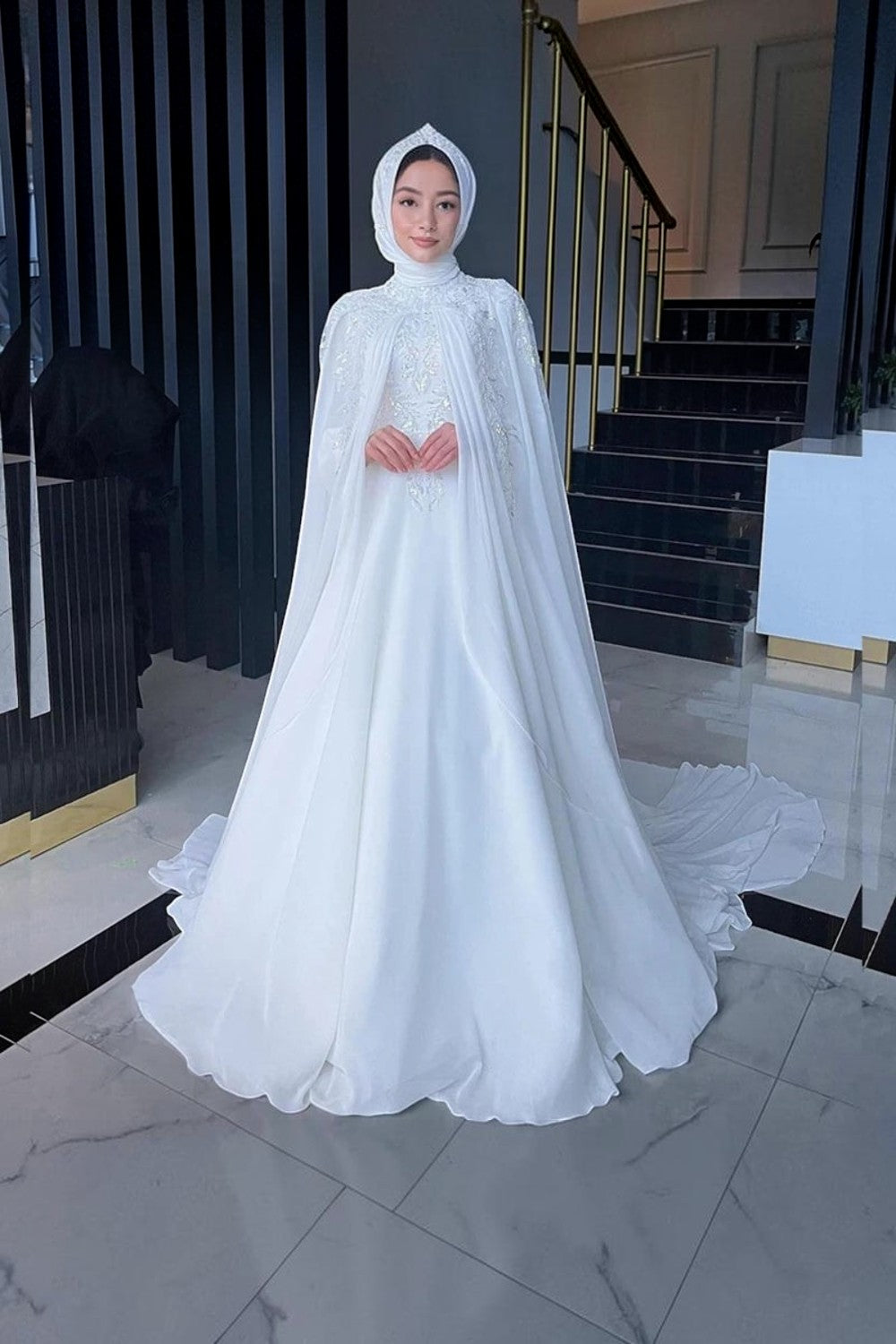 TheBlissWedding modest white chiffon bridal gown with high neck, long sleeves, pearl detailing, and matching hijab