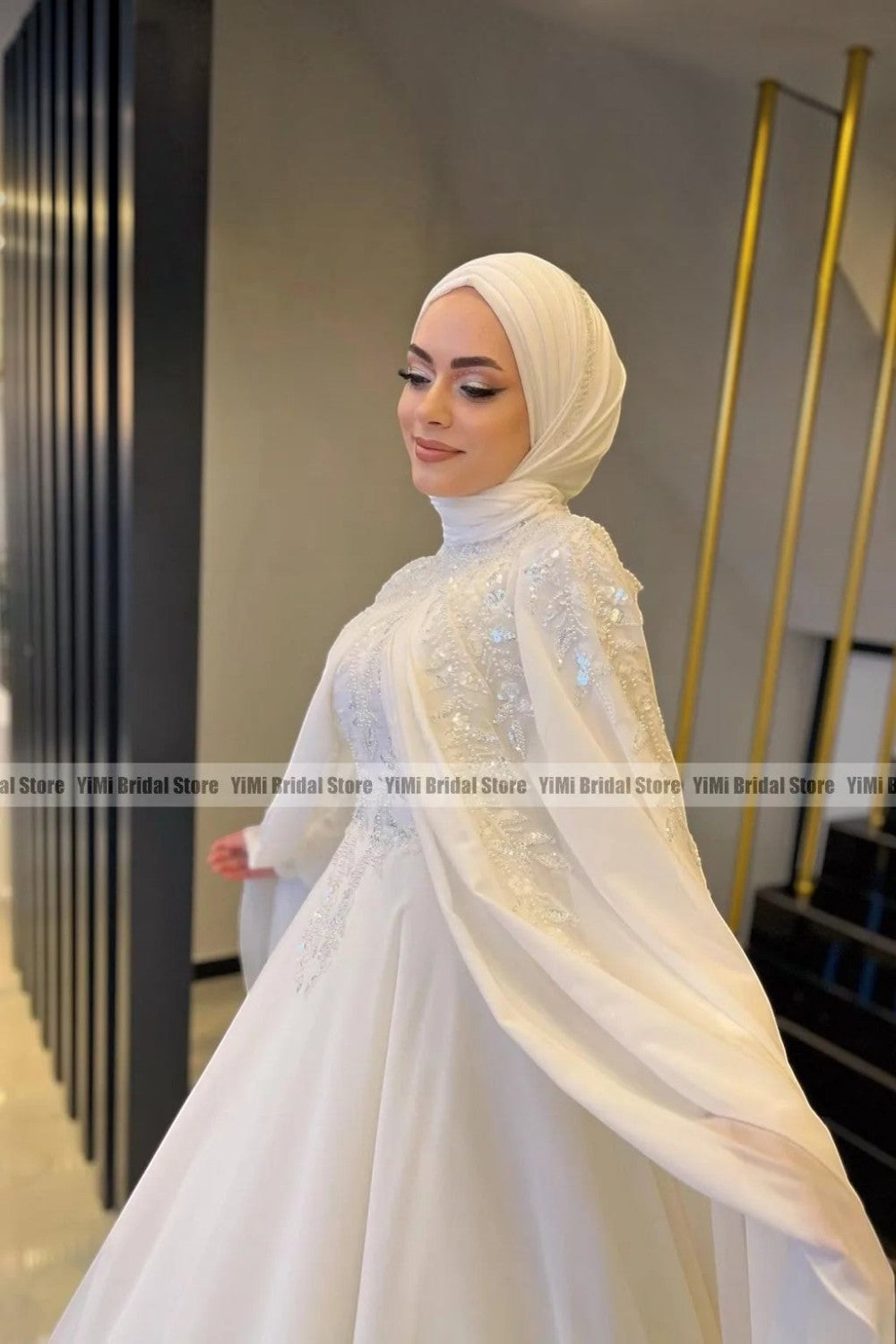TheBlissWedding modest white chiffon bridal gown with high neck, long sleeves, and delicate pearl embellishments