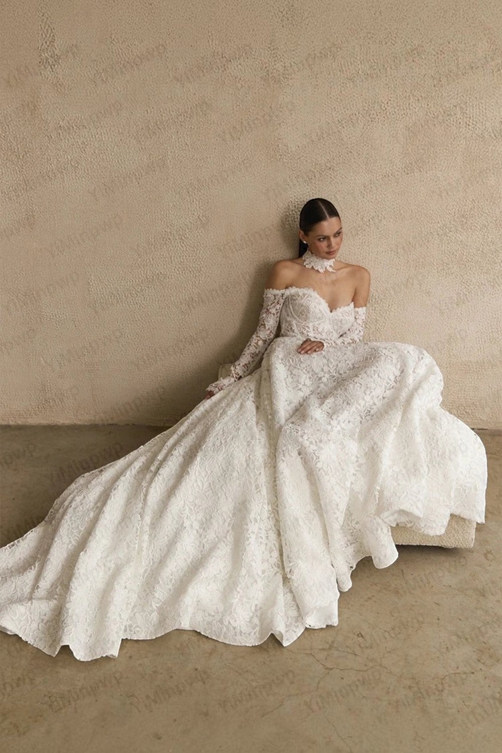 TheBlissWedding white off-shoulder A-line wedding dress with long lace sleeves and a sweetheart neckline.