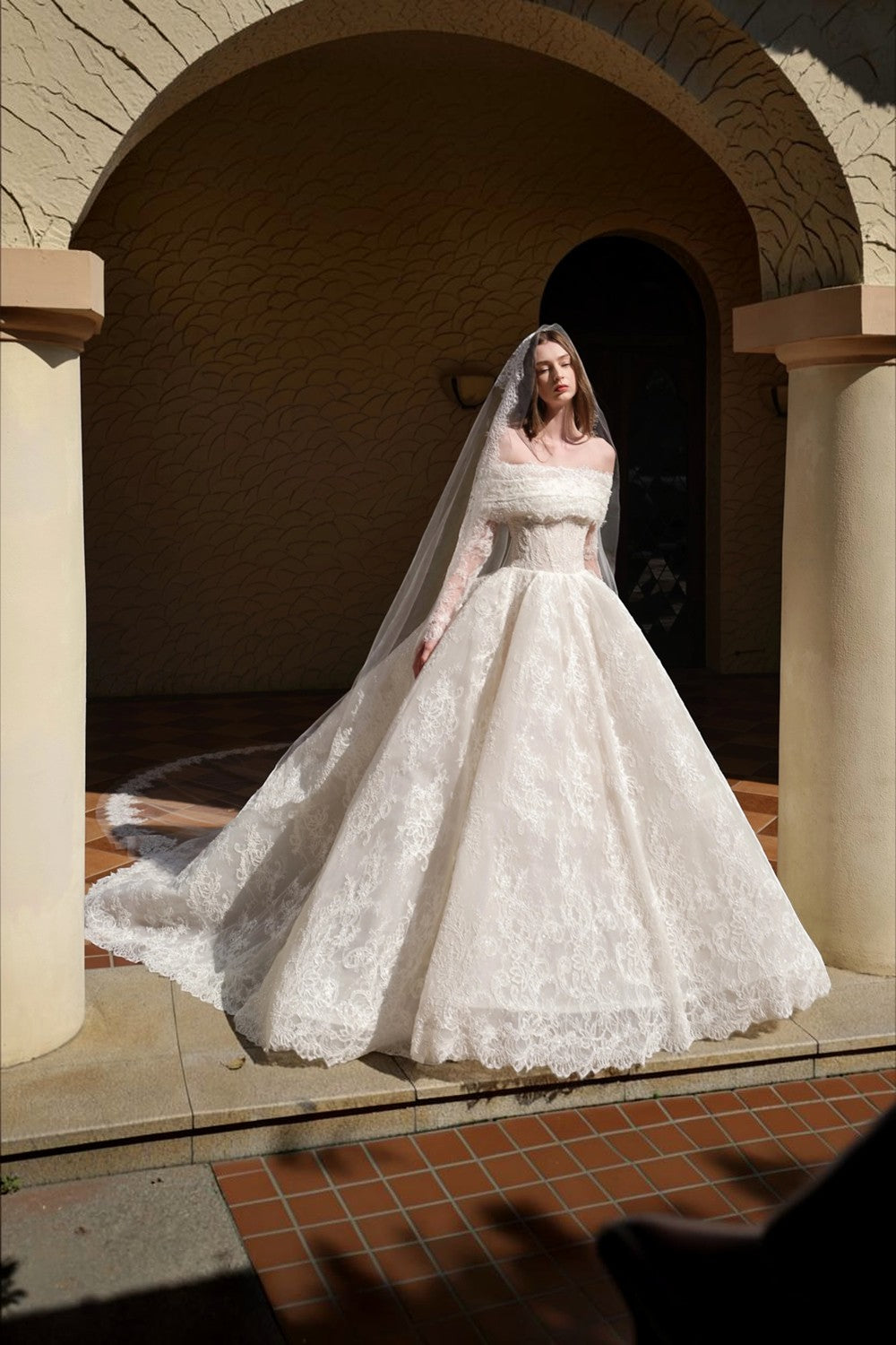 TheBlissWedding white off-shoulder A-line wedding dress with long lace sleeves and intricate floral appliques
