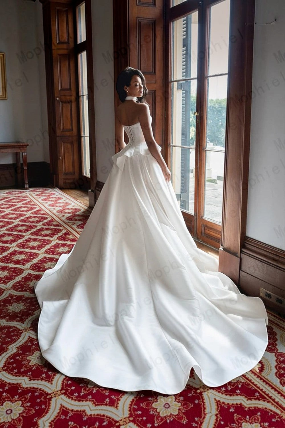 TheBlissWedding white satin A-line wedding dress with a sweetheart neckline and lace-up back in a formal room.