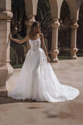 TheBlissWedding strapless mermaid bridal gown with intricate lace appliques and a dramatic detachable train.