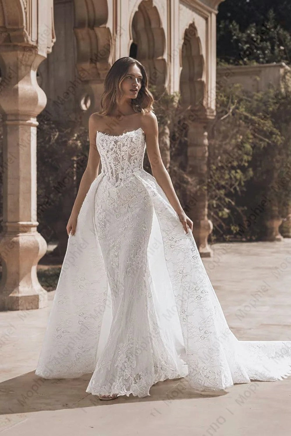 TheBlissWedding strapless mermaid wedding dress with intricate lace appliques and a dramatic detachable train